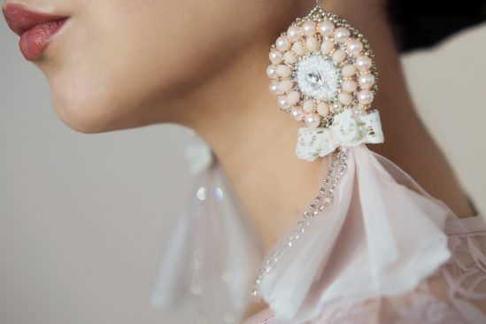 Bride wearing oversized boho pearl earrings