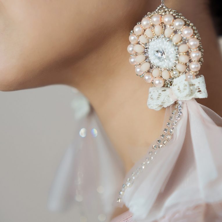 Bride wearing oversized boho pearl earrings