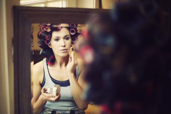 Bride doing her makeup