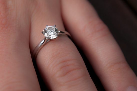 Showing engagement ring