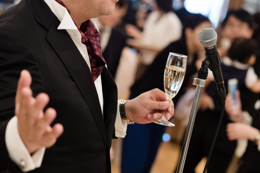 Father giving speech with champagne