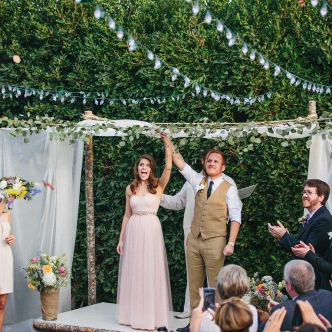 Bride and Groom getting married in a backyard wedding themed celebration