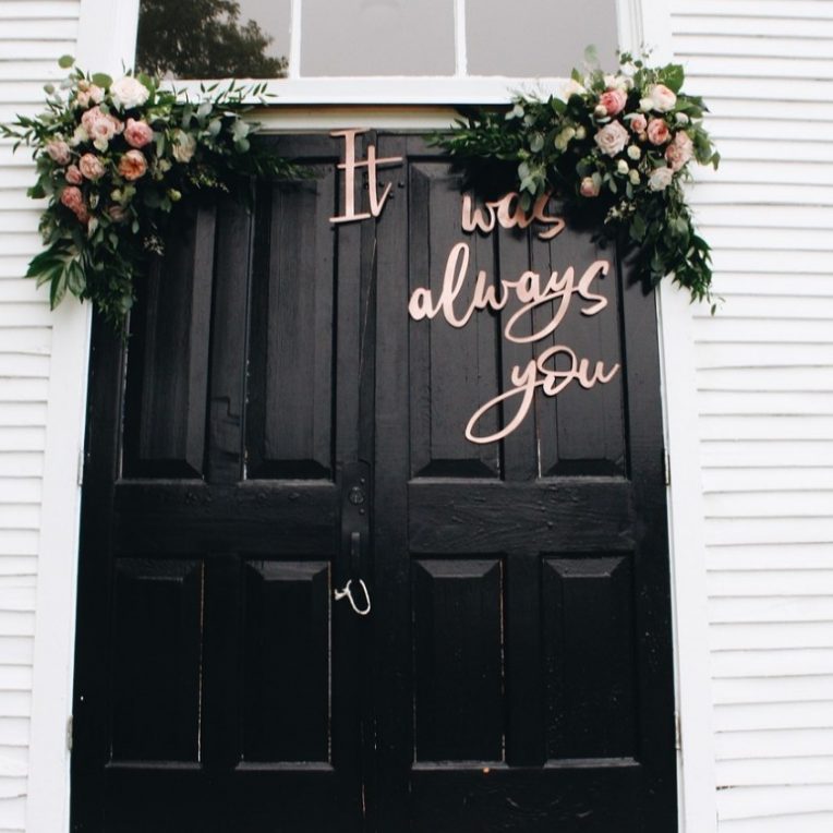 door with wedding signage