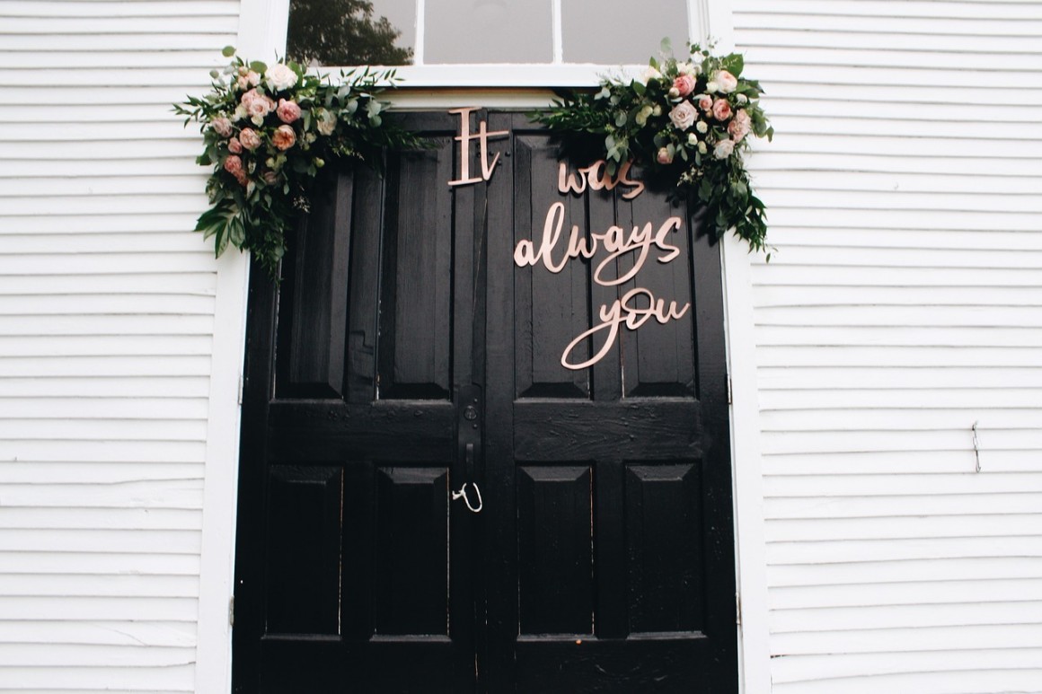 door with wedding signage