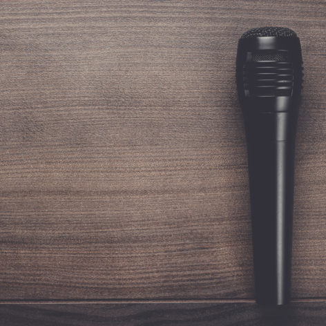 black mic on the brown wooden table