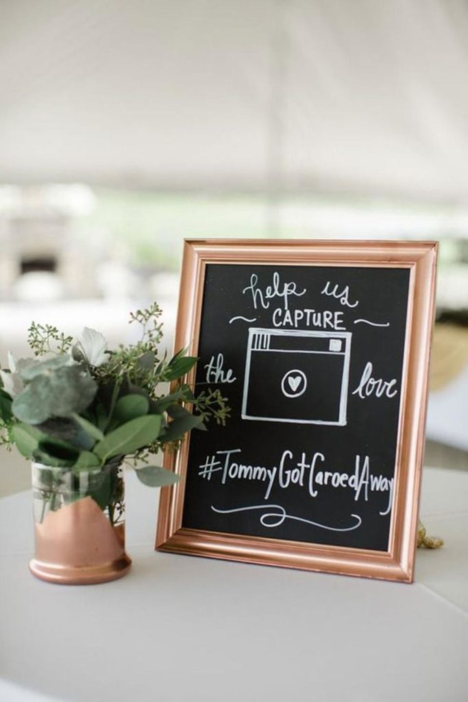 Wedding hashtag displayed in a picture frame