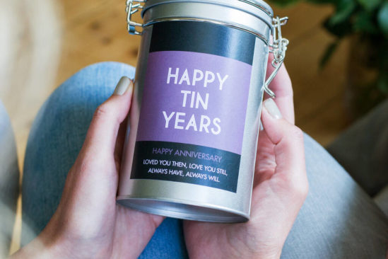 Woman holding Personalized Anniversary Coffee Gift in tin