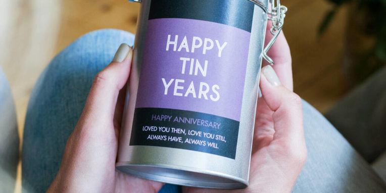 Woman holding Personalized Anniversary Coffee Gift in tin