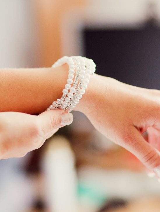 Bride showing her pearl bracelet on her wrist