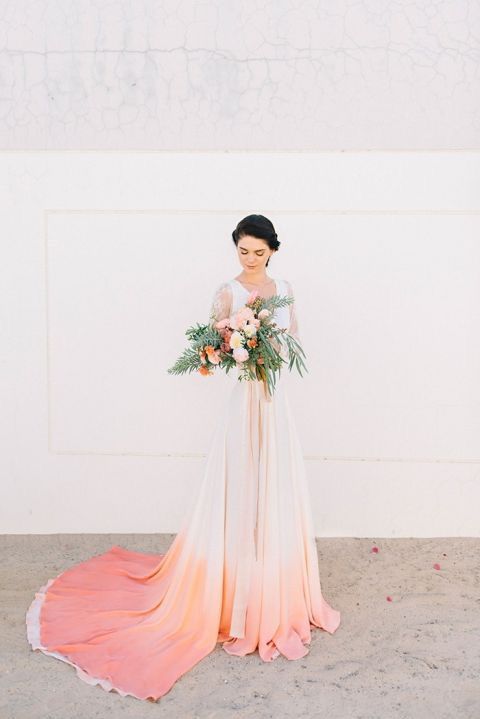 Bride wearing peach ombre wedding dress.