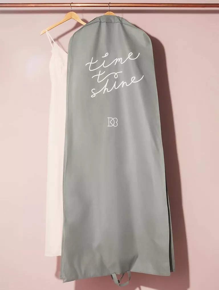 Grey wedding dress garment bag by Davids Bridal with slogan Time To Shine