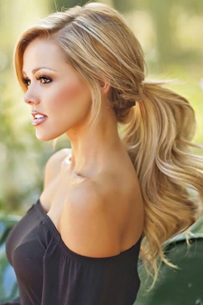 Side photo showing bridesmaids fluffy, and sophisticated ponytail hairstyle