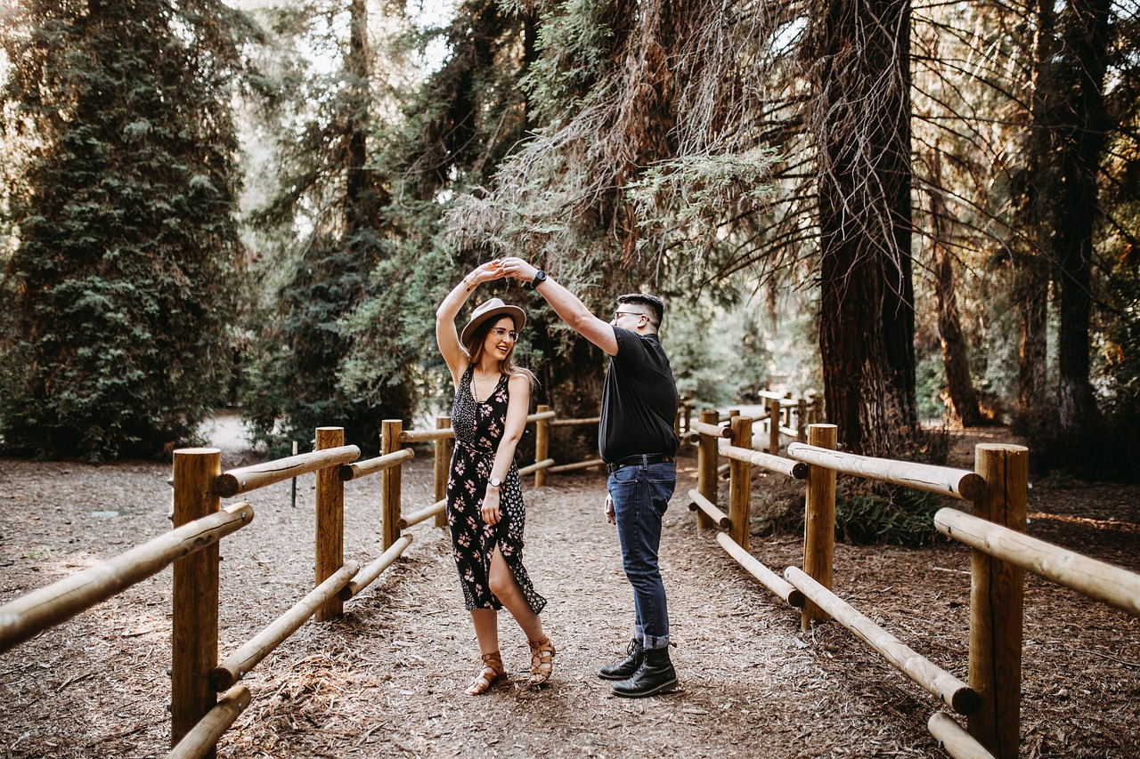couple dancing on a forest path