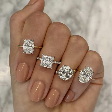 multiple engagement rings on a hand