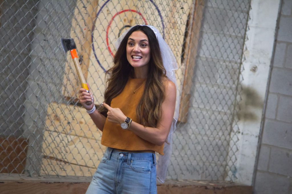 girl at axe throwing event