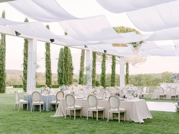 formal outdoor wedding with white table linens