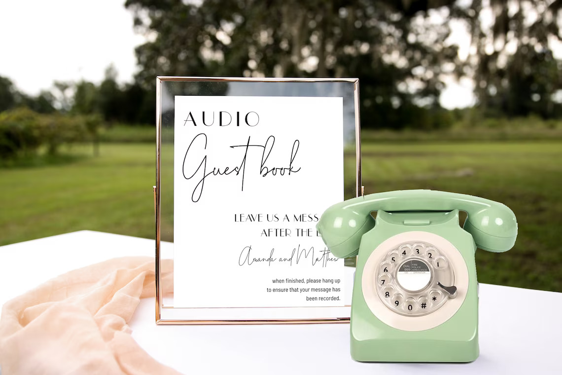 Rotary phone with a sign reading audio guestbook